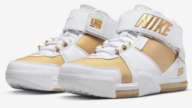 View of LeBron James' white and gold Nike shoes.